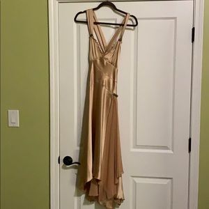 Gold cocktail dress with antique accents on strap.